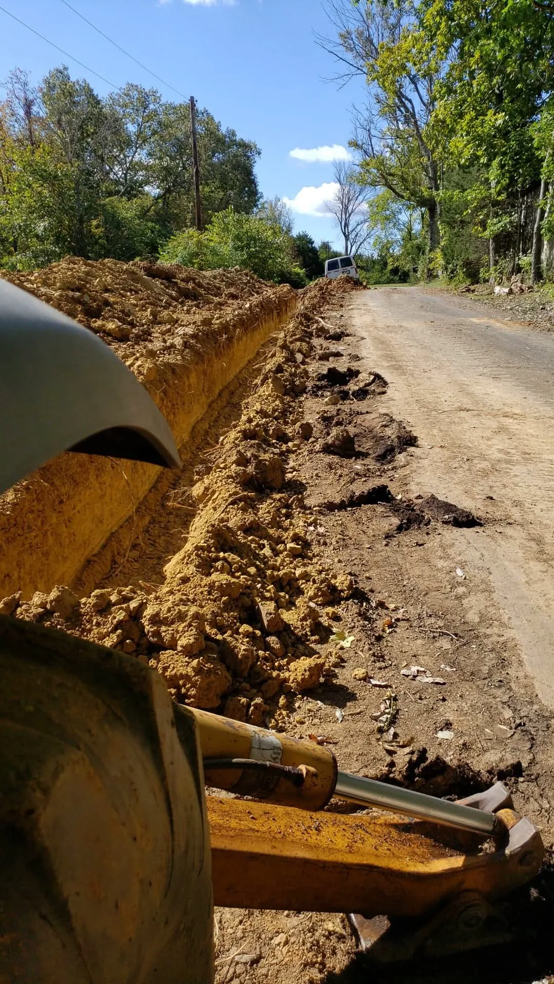 Excavation backhoe grading a Northern Kentucky job site